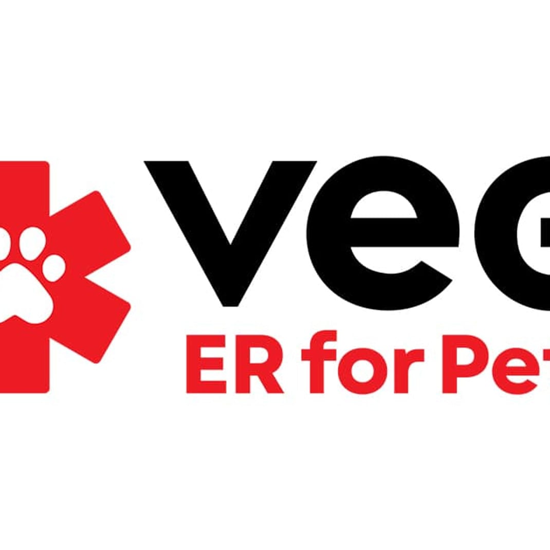 VEG ER for Pets logo with a red medical star containing a white paw print