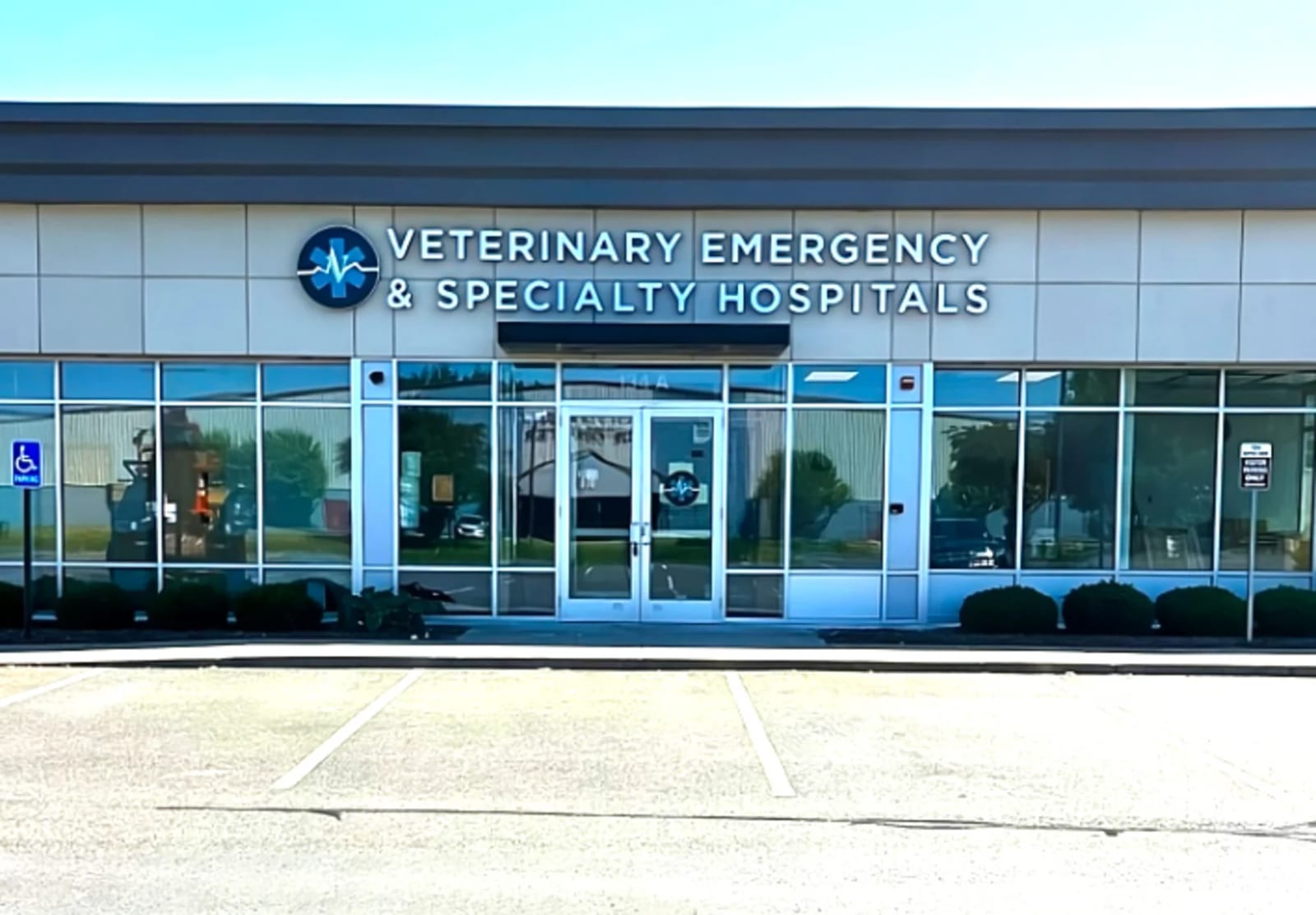 Veterinary Emergency & Specialty Hospitals building with a blue sign over glass doors