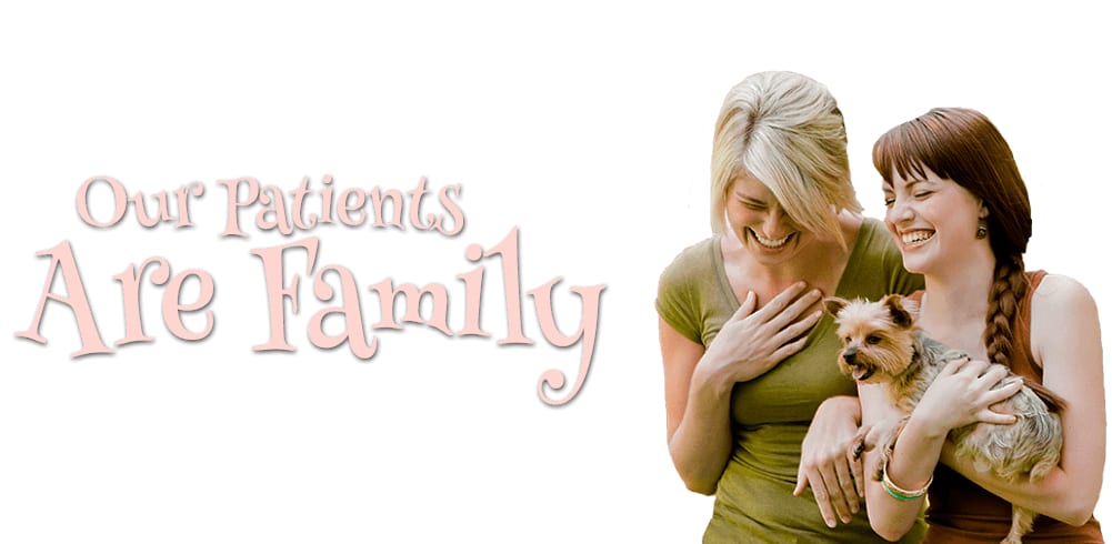 Banner reading Our Patients Are Family, with two laughing women holding a small dog