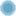 Tiny light blue circle on a white background with no other content