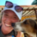 Blurry low-resolution photo of a smiling person in a white cap with a tan dog's face