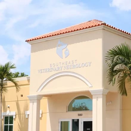 Southeast Veterinary Neurology building with a terracotta tile roof and a logo above the entrance