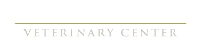 Partial logo with the words VETERINARY CENTER in grey capitals under a thin olive line